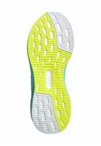 Semelle de chaussure avec un design en caoutchouc jaune et blanc, dotée de motifs de grip texturés et d'un bord teal. Conçue pour la durabilité et l'adhérence.