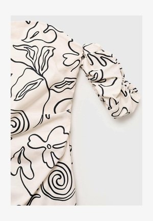Light fabric top featuring a cream background with black floral line art. The puffed sleeve has gathered details for texture.