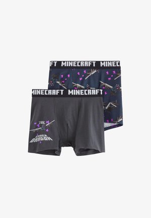 Baumwoll-Shorts für Jungs, eine dunkelgrau mit dem Drucktext "Kämpfe gegen den Enderdrachen", eine marineblau mit bunten Minecraft-Motiven. Schwarzer elastischer Bund.