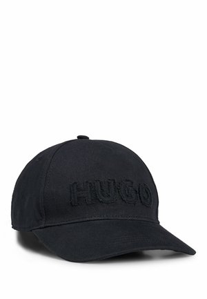 Black baseball cap made from fabric with an embroidered "HUGO" logo on the front. Features a curved brim and adjustable back strap.