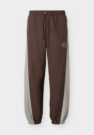 Pantalon de sport marron et gris avec ceinture et poignets élastiques, cordon de serrage, et petit logo sur la partie supérieure de la cuisse gauche.