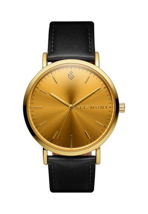 Gull rund urskive med gull time markører, svart lærrem, viser 10:10:34, merkenavn Seizmont på urskiven.