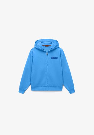 Sininen vetoketjullinen huppari, jossa on pitkät hihat ja pieni suorakulmainen logoplässi vasemmalla rinnalla.