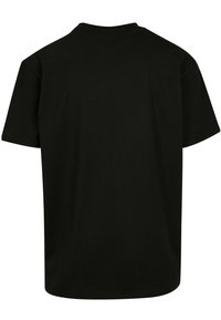 Black short-sleeve T-shirt made from cotton, featuring a round neckline and a loose fit, without visible logos or patterns.