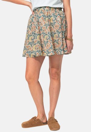 Jupe patineuse à motif floral bleu, orange et jaune, avec une taille élastique pour plus de confort. Tissu léger avec une coupe évasée.