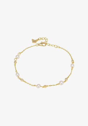 Bracelet chaîne en or présentant des perles blanches alternées avec des cristaux transparents. Fermoir homard avec longueur ajustable grâce à une chaînette d'extension à maillons.