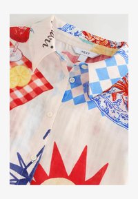 Unselected, cream red map print