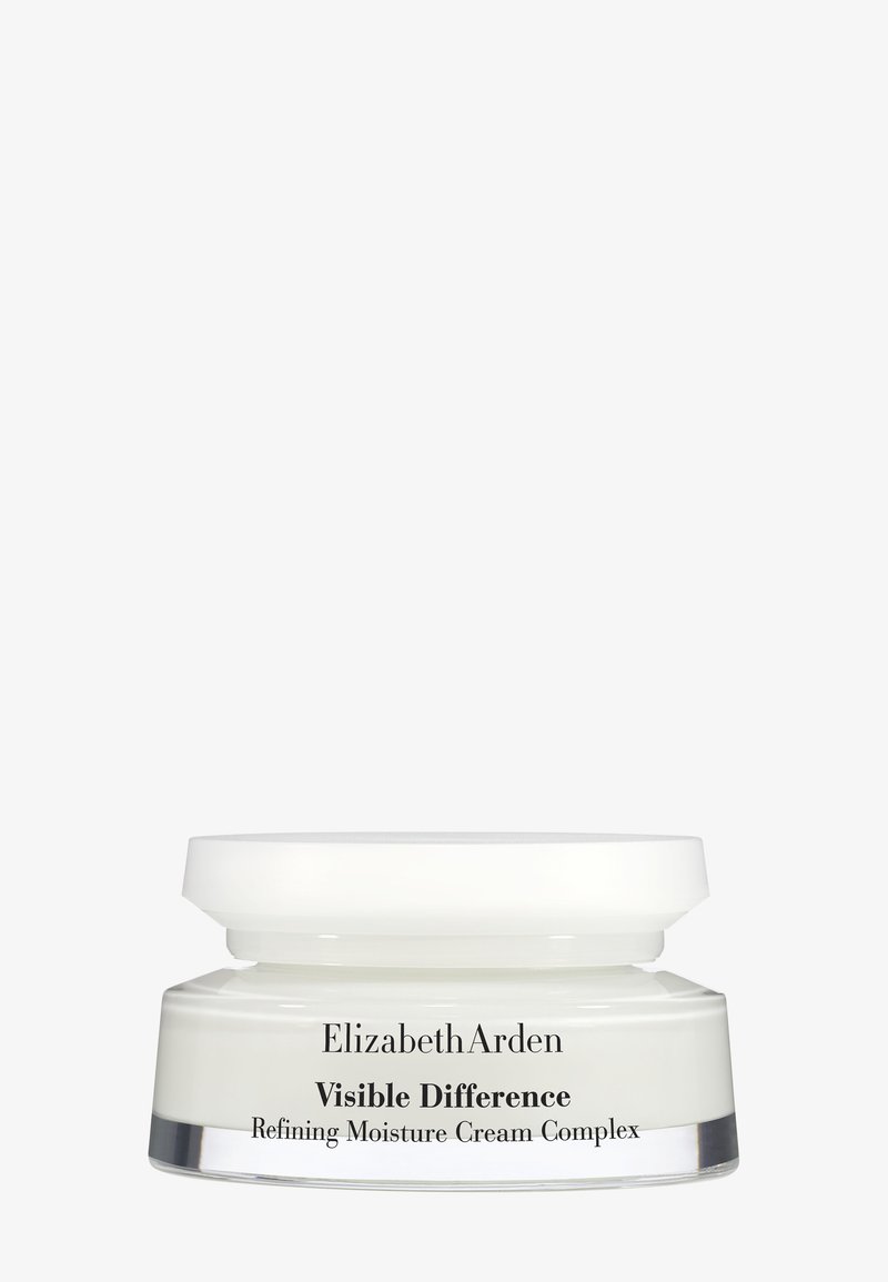 Elizabeth Arden Visible Difference Refining Moisture Cream Complex dans un pot blanc avec un couvercle plat sur un fond uni.