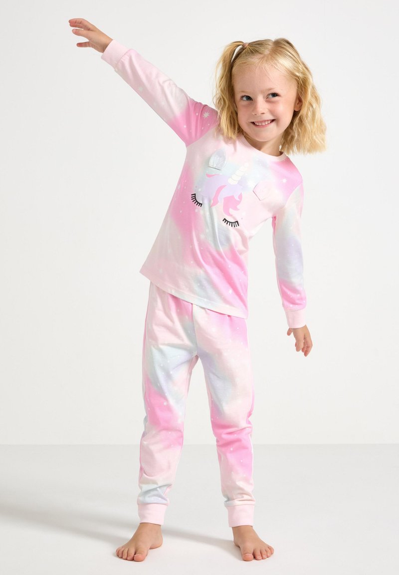 Set di pigiama con motivo galattico in rosa e pastello, caratterizzato da un grafiche di unicorno sulla maglietta e pantaloni aderenti con orli a giro. Materiale morbido.