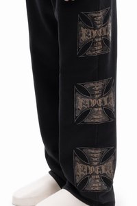 Black sweatpants featuring large gray graphic designs on the sides. The fabric appears soft with a smooth texture.