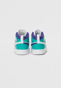 High-top sneakers in turquoise and purple with white accents, featuring a smooth leather exterior and a textured rubber sole.