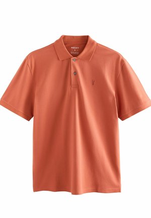 Orange polo shirt lavet af bomuld, med krave, tre-knaps lukning og et lille logo på venstre bryst. Normal pasform.