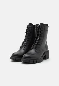 Tamaris Botines con plataforma - black