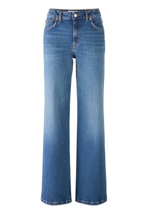 Vaaleansiniset korkeat leveälahkeiset farkut, joissa on viisi taskua, kupariset niitit ja haalistunut pesu.