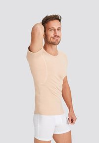 Beige short-sleeve t-shirt made of soft material with a fitted design. Notable features include smooth seams and a round neckline.