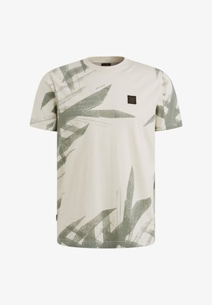 Kremowa bawełniana koszulka z krótkim rękawem z zielonym wzorem liści oraz małą czarną metką na piersi dla oznaczenia marki.