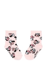 Para różowych skarpetek dla małych dzieci z powtarzającymi się twarzami Minnie Mouse z różowymi kokardami i logo Disneya na białym tle.
