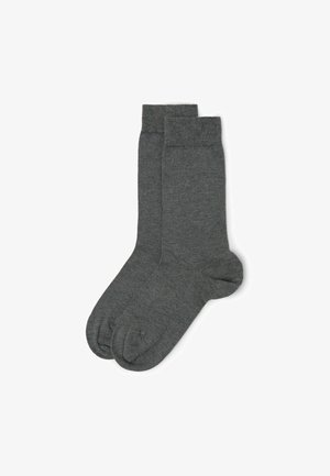Graue Baumwollmischsocken in Crew-Länge mit gerippten Bündchen, weicher Textur und glatter Oberfläche. Keine ausgeprägten Muster oder Verzierungen.