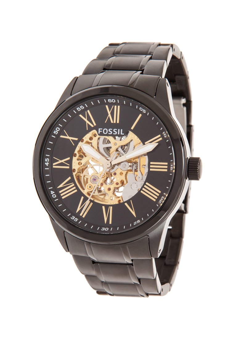 Reloj Fossil con pulsera de acero inoxidable negro, caja redonda, diseño esqueleto, engranajes dorados y índices en números romanos en una esfera negra.