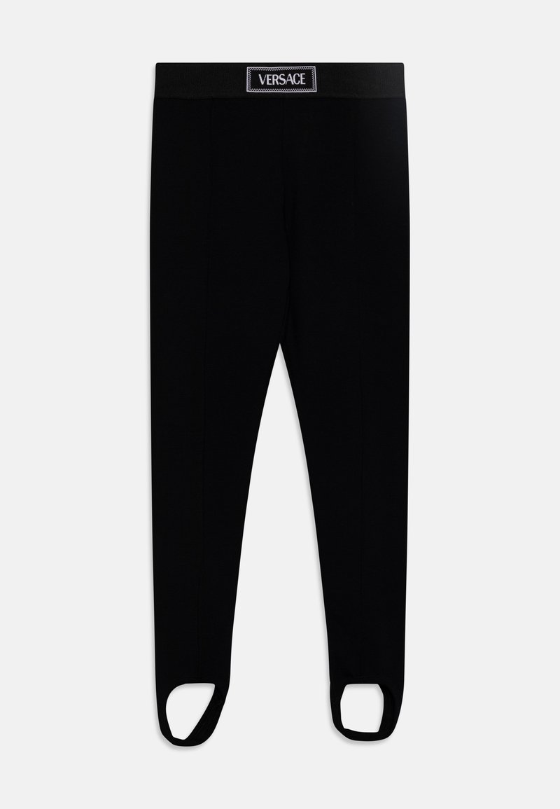 Μαύρο κολάν με φαρδύ λάστιχο στη μέση που φέρει επωνυμία, ανοιχτές εσοχές στα πόδια και λεία, ομαλή υφή υφάσματος.