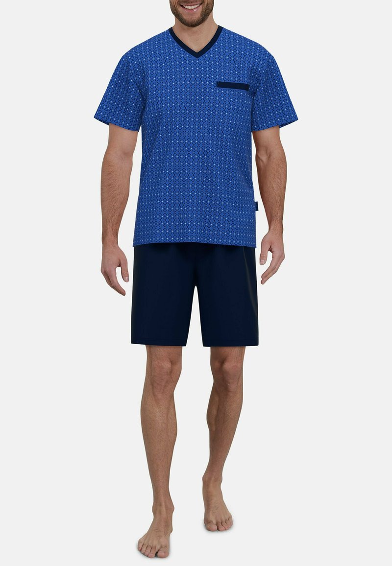 Blue patterned short-sleeve V-neck top with a chest pocket, paired with solid dark blue shorts, made from soft fabric.