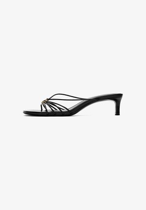 Black strappy kitten heel sandal with thin straps and a small gold buckle detail on a white background.