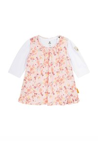 Rosa Blumenkleid mit langen weißen Ärmeln, das über einen gerafften Halsausschnitt, einen Volantsaum und einen Knopfdetails am Ärmel verfügt. Das Blumenmuster enthält orange und gelbe Akzente.