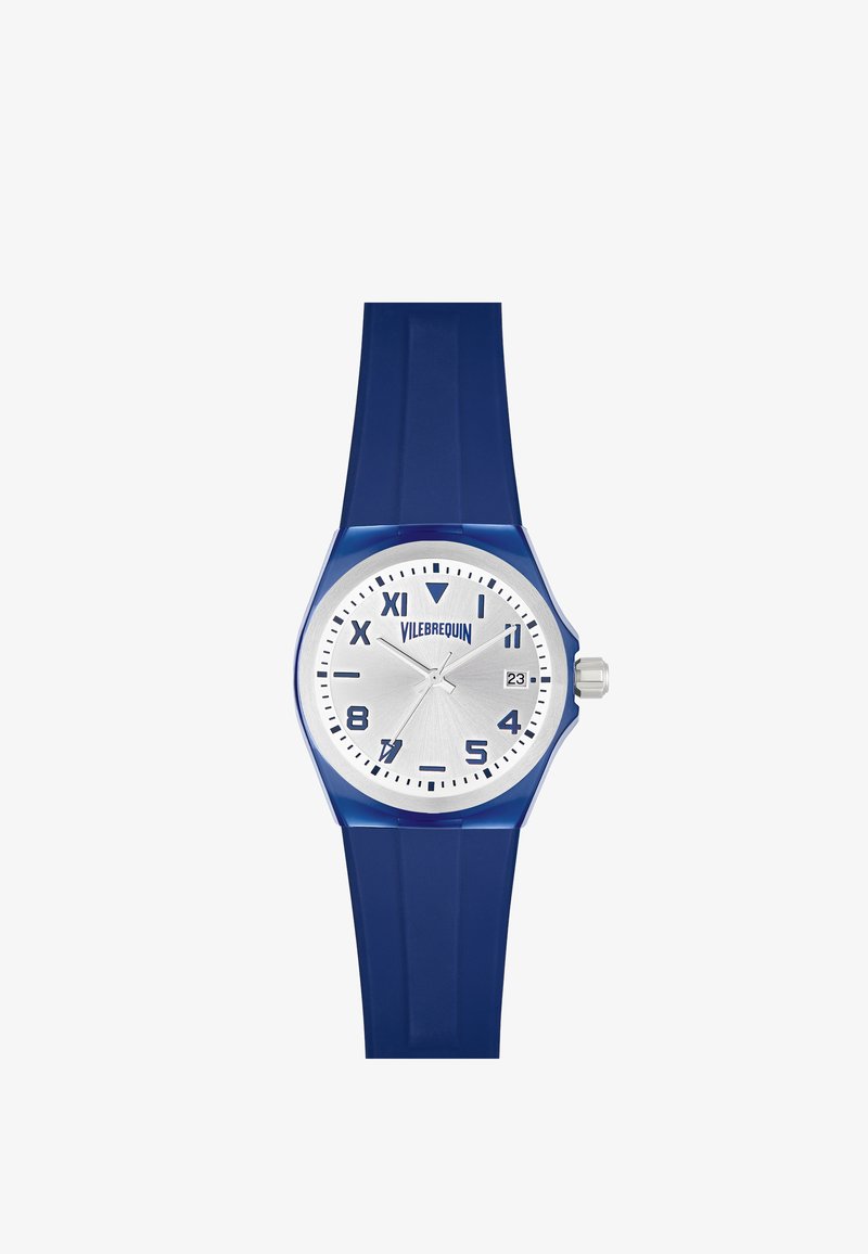 Reloj de silicona azul con esfera plateada, marcadores de hora en negrita y ventana de fecha. Presenta una caja redonda y un diseño de correa paralela.