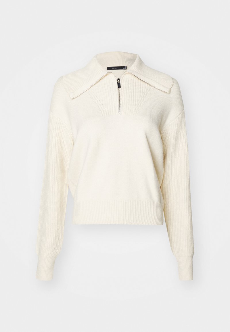 Cream-colored knit pullover with a zippered mock collar, ribbed texture, long sleeves, and a relaxed cropped fit. Accents include a seam detailing.