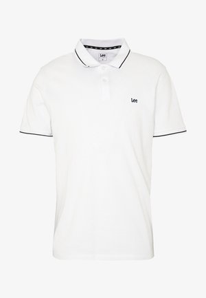 Biała koszulka polo wykonana z bawełny, z klasycznym kołnierzykiem, zapięciem na guziki oraz granatowym obszyciem wzdłuż kołnierzyka i brzegów rękawów. Ma logo Lee.