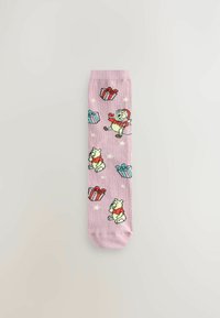 Pink socks featuring cartoon bears in festive attire among colorful gift boxes and stars. Soft material, vibrant colors, and playful design.