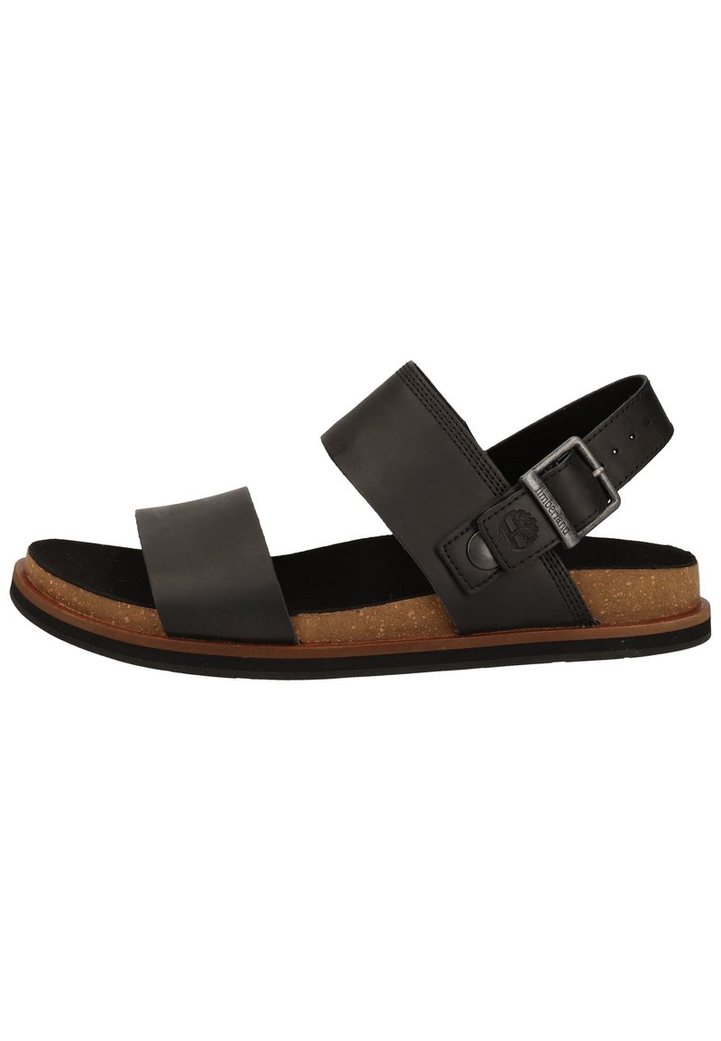 Sandale en cuir noir avec deux larges sangles, boucle réglable et semelle en liège. La semelle en caoutchouc contrastante offre une bonne adhérence.