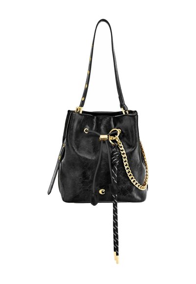 Črna usnjena torba v obliki vedra z nastavljivim trakom, zlato verižico, z zategovalnim zapiranjem in okrasnimi črno-belimi črtastimi cofki.