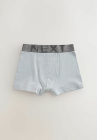 Bóxers para hombre de color azul claro con cintura elástica gris que lleva el nombre de la marca "NEXT" en letras grandes.