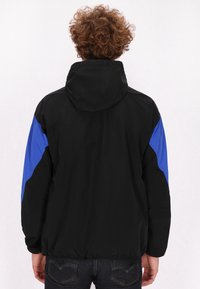 Schmuddelwedda urban rain - Chaqueta outdoor - schwarz königsblau colorblock