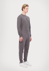 EA7 Emporio Armani PANTALONI - Träningsbyxor - volcanic glass