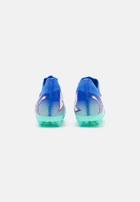 Puma FUTURE 7 PRO FG/AG JR UNISEX - Kopačky na pevný povrch - bluemazing/white/electric peppermint