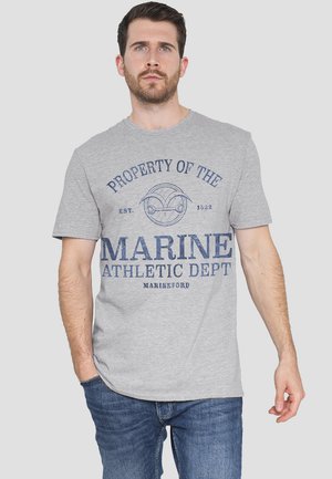 Gray cotton T-shirt featuring blue graphic text "PROPERTY OF THE MARINE ATHLETIC DEPT EST. 1522 MARINEFORD" on the front. Short sleeves.