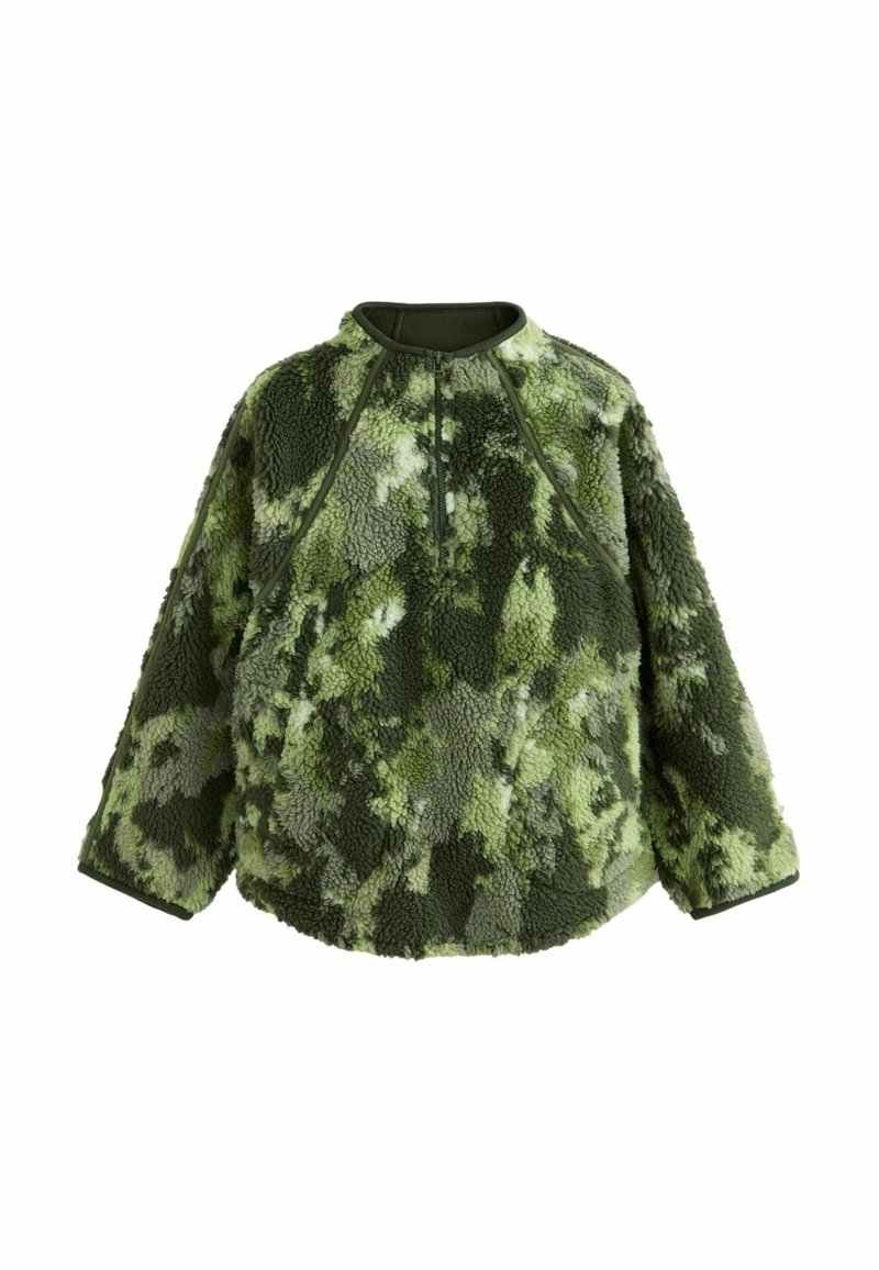 Zeleni flis pulover s nježnom teksturom, koji ima visoki ovratnik i četvrtasti zatvarač. Uzorak s različitim nijansama zelene. Široki rukavi.