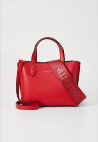 Red leather handbag with two short handles and a removable shoulder strap. Features textured surface and embossed brand name in gold.