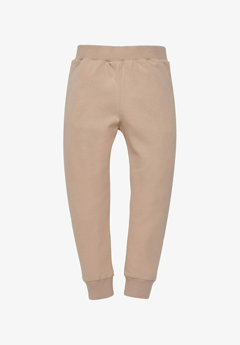 Pantaloni della felpa beige con una texture morbida, gambe affusolate e vita e polsini a costine per una vestibilità comoda. Senza tasche o dettagli aggiuntivi.