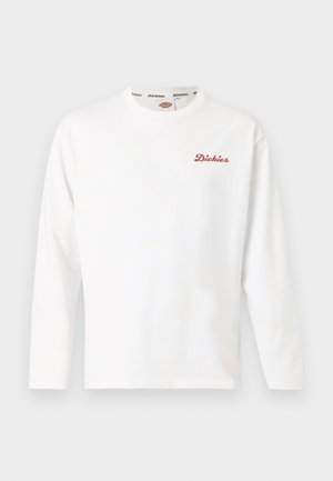 Valge pikkade varrukatega kaelusega särk, millel vasakul rinnal väike punane "Dickies" logo ja kaeluse sees bränditatud vooder.