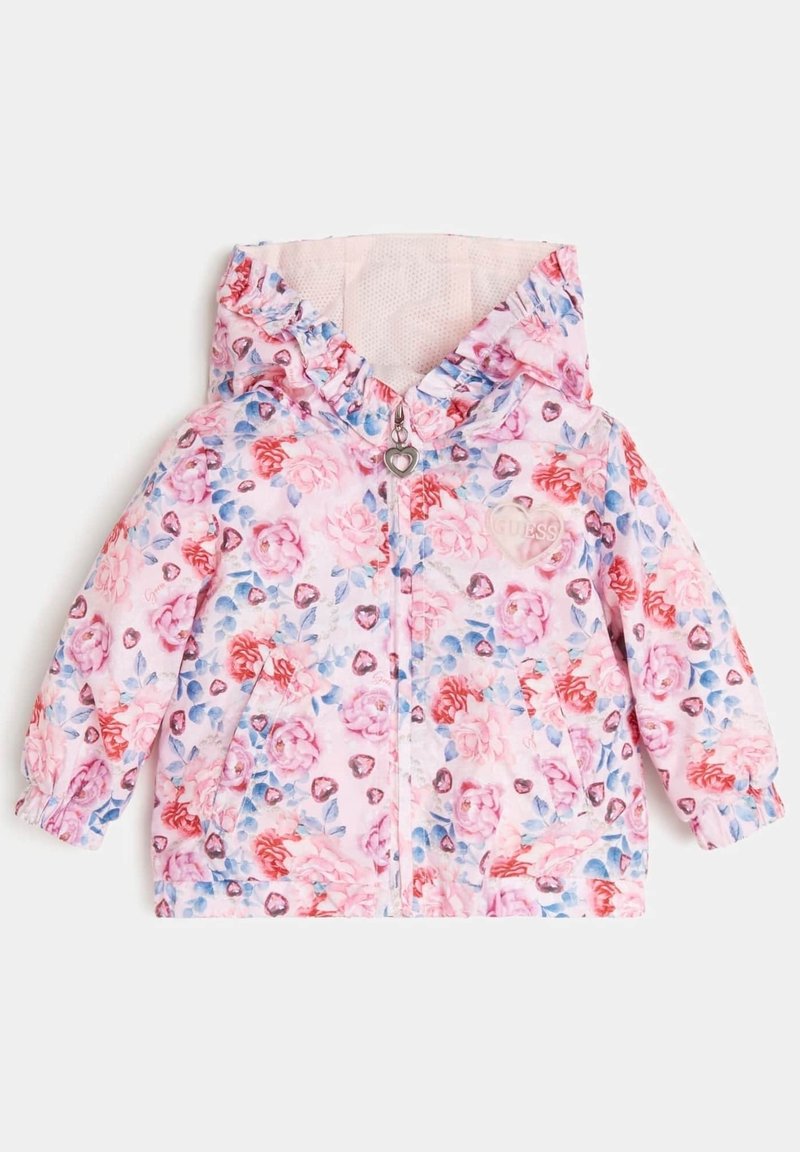 Różowa kurtka w kwiatowy wzór z kapturem, z zapięciem na zamek, elastycznymi mankietami oraz akcentem w kształcie serca. Wyścielona od środka polarem.