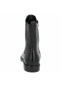 Bota de tobillo de cuero negro con un acabado suave, que cuenta con paneles laterales elásticos y una cremallera trasera para poner y quitar fácilmente. Punta redonda y suela plana.