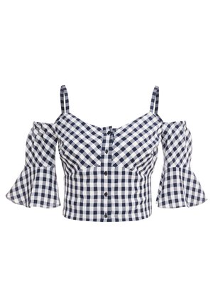 Crop top vichy bleu marine et blanc avec boutons devant, fines bretelles et manches cloche tombantes.