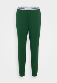 Grønne bomullssweatpants med en ribbet midje som har hvite og marineblå striper, som smalner inn ved anklene for en tettsittende look.