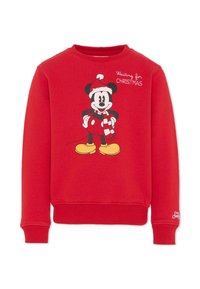 Sweatshirt rouge à col rond, arborant un graphisme de Mickey Mouse portant un chapeau de Noël et une écharpe rayée, avec le texte "En attendant Noël."