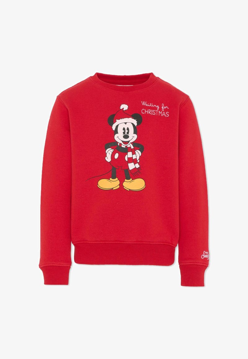 Sweatshirt rouge à col rond, arborant un graphisme de Mickey Mouse portant un chapeau de Noël et une écharpe rayée, avec le texte "En attendant Noël."