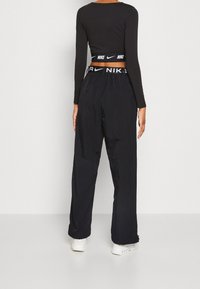 Nike Sportswear Tygbyxor - black