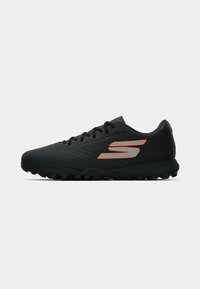 Black athletic shoes with a textured surface, featuring an orange logo, lace-up design, and rugged outsole for traction.
